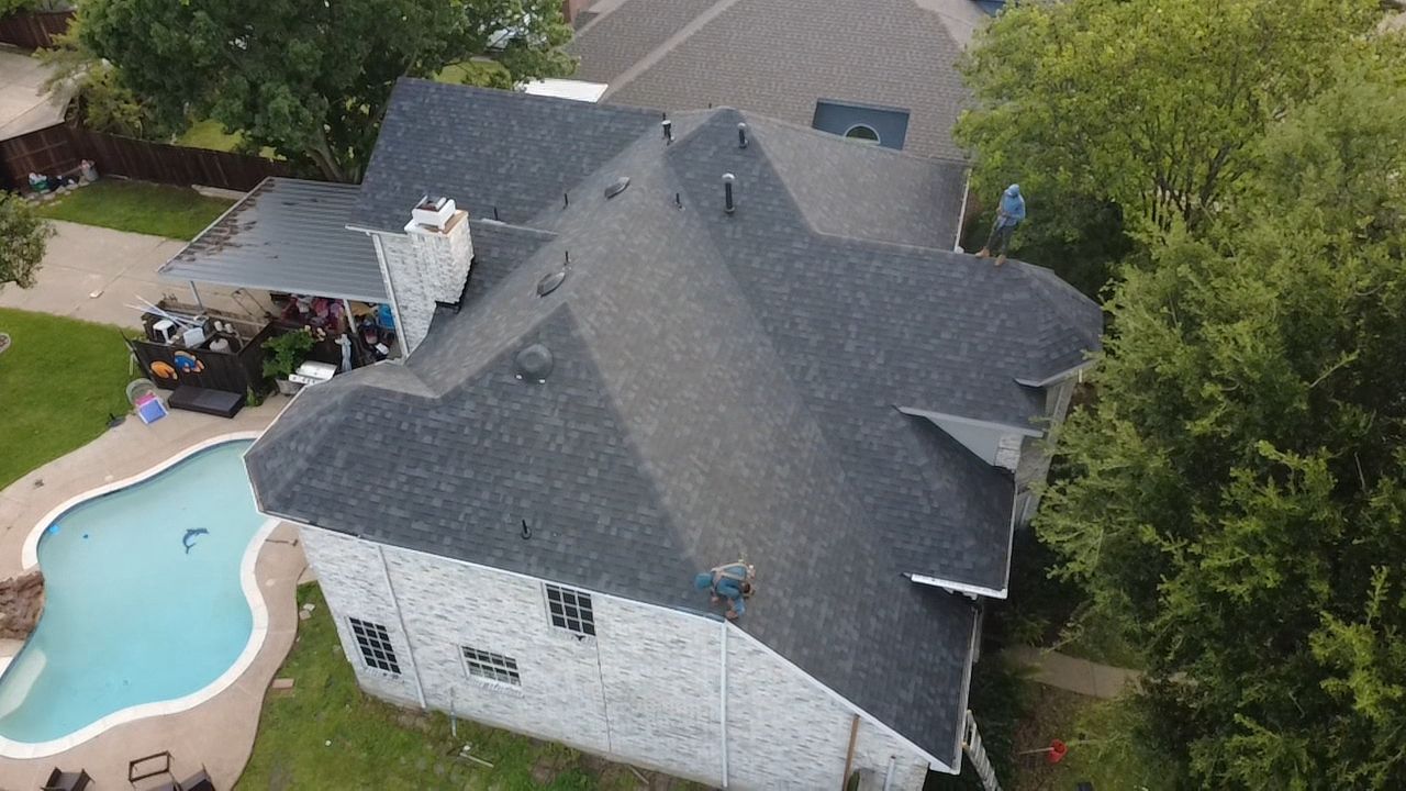 Aerial view of crew installing new roof
